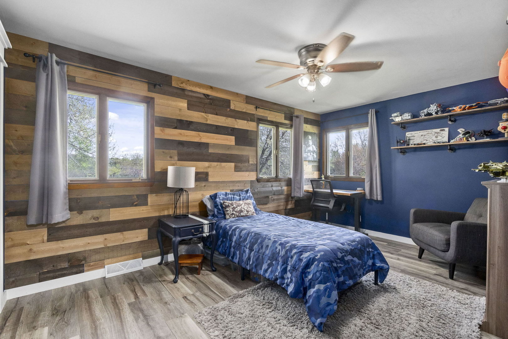 S888 Wenmoth Road Batavia, IL 60510 - Photo 17 of 40 a spacious bedroom with a bed a chandelier and a window