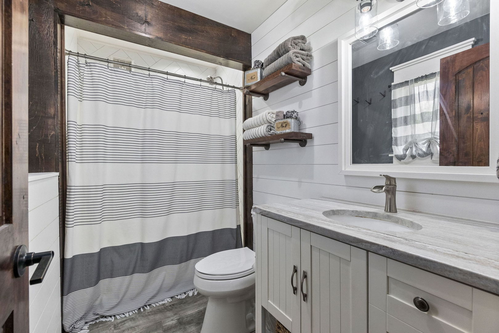 S888 Wenmoth Road Batavia, IL 60510 - Photo 18 of 40 a bathroom with a sink a toilet and shower