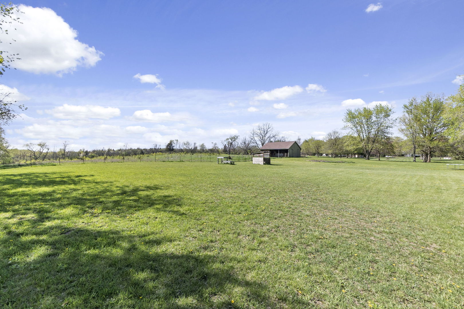 S888 Wenmoth Road Batavia, IL 60510 - Photo 39 of 40 a view of a big yard with plants and large trees