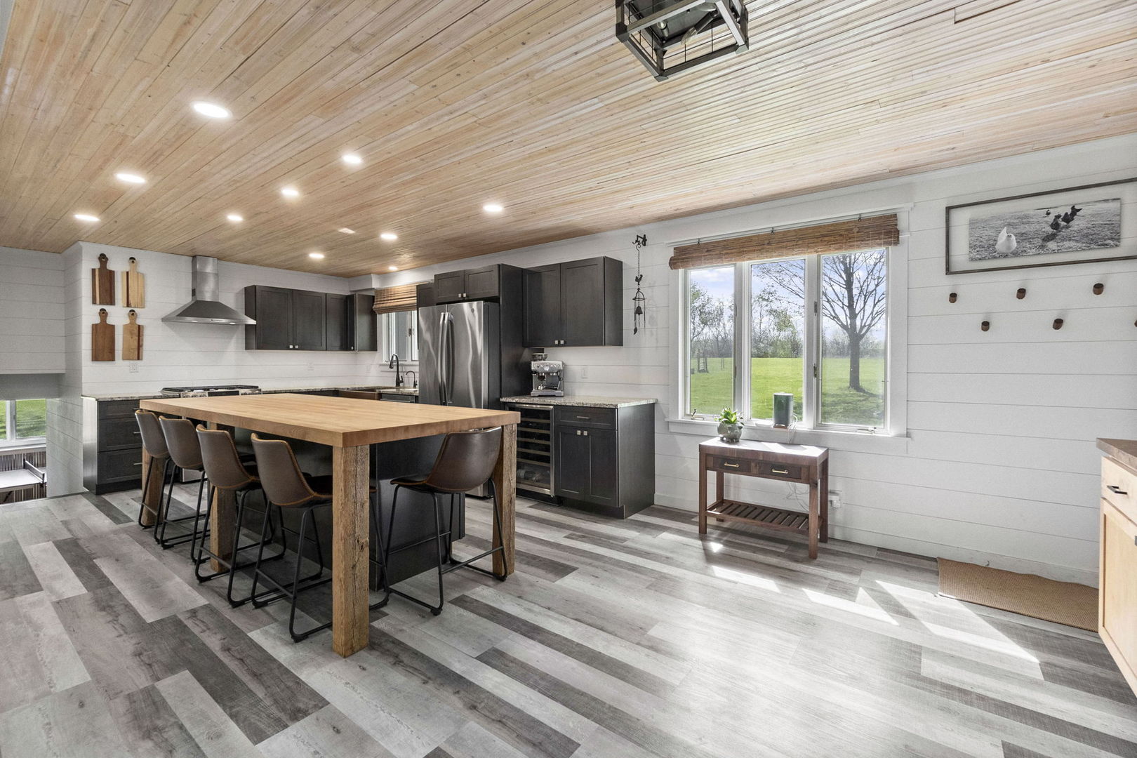 S888 Wenmoth Road Batavia, IL 60510 - Photo 5 of 40 a kitchen with a table chairs refrigerator and cabinets