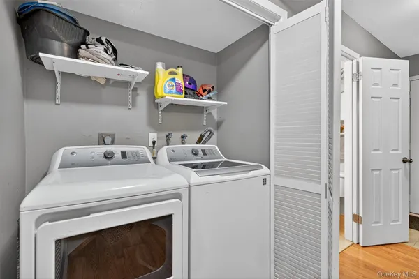a utility room with dryer and washer