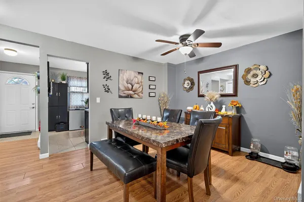 a view of a dining room with furniture and wooden floor