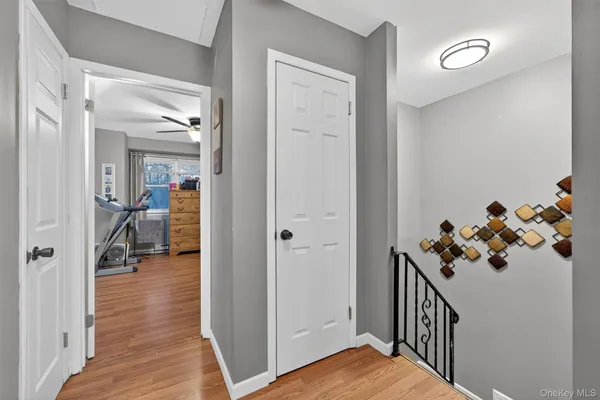 a view of a hallway and a livingroom and a hallway