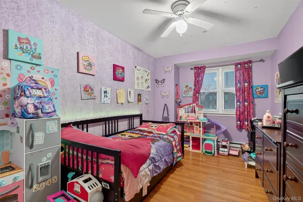 a bedroom with furniture and a baby crib