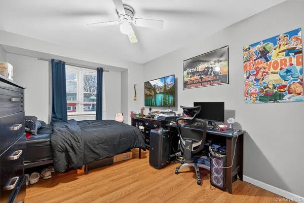 a bedroom with a bed and a desk