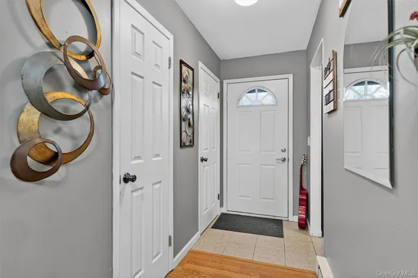 a bathroom with a mirror and a shower