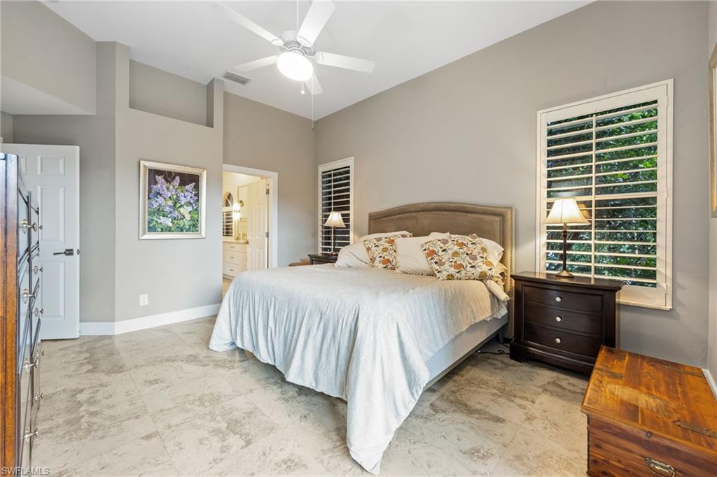 5188 Mabry Drive Naples, FL 34112 - Photo 20 of 49 a bedroom with a bed and a window