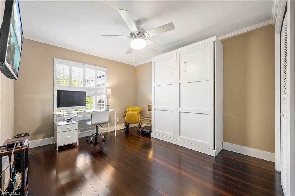 5188 Mabry Drive Naples, FL 34112 - Photo 29 of 49 a living room with furniture and a flat screen tv