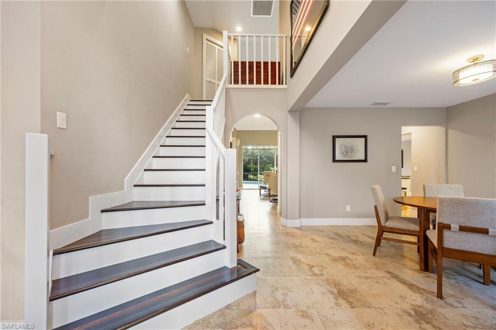 5188 Mabry Drive Naples, FL 34112 - Photo 4 of 49 a view of entryway and hall with wooden floor
