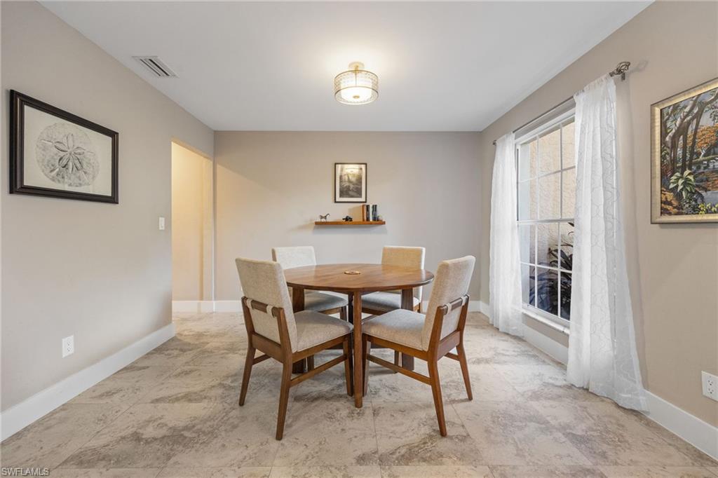 5188 Mabry Drive Naples, FL 34112 - Photo 5 of 49 a dining room with furniture and window