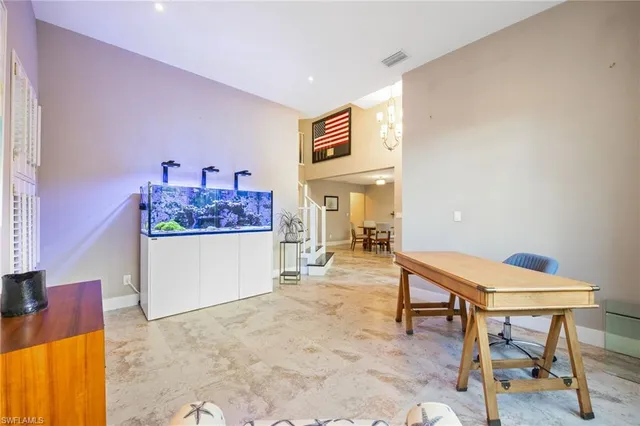 a living room with furniture and a table