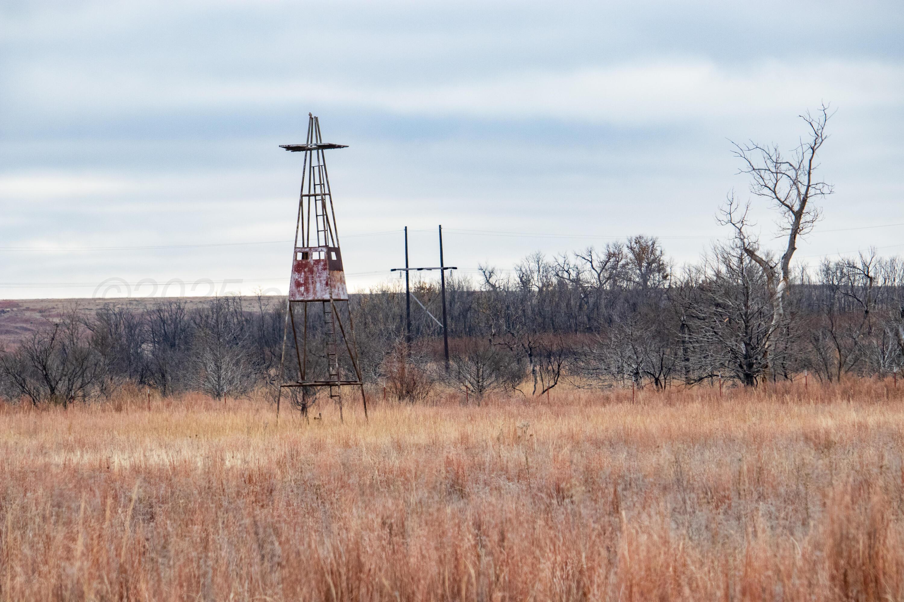 Triple S Canadian River Ranch Canadian, TX 79014 - Photo 40 of 88 a view of a lake with a yard