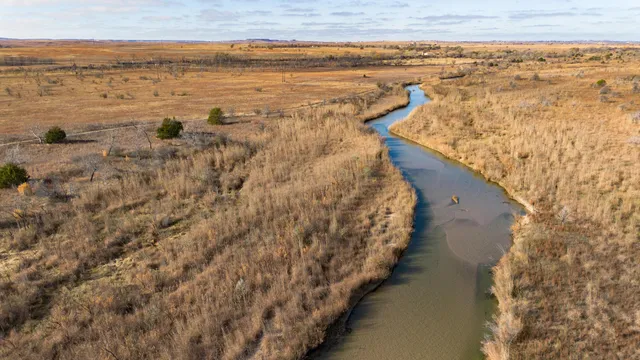 a view of a lake with a yard