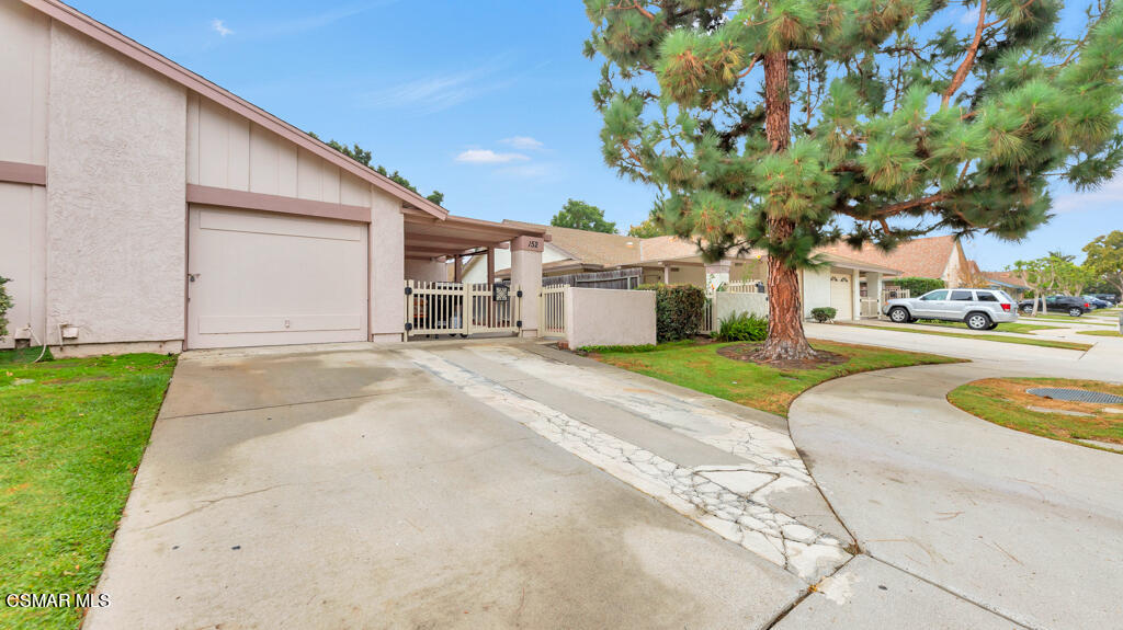 152 Ripley Street Camarillo, CA 93010 - Photo 2 of 36 a front view of a house with a yard and trees