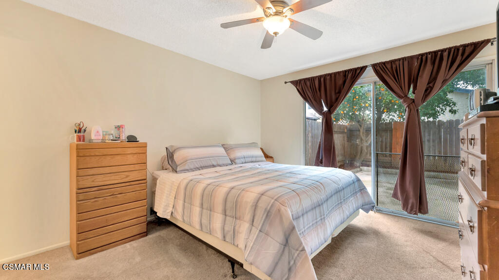 152 Ripley Street Camarillo, CA 93010 - Photo 14 of 36 a bedroom with a bed and a chandelier