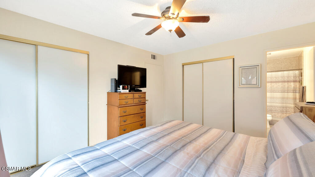 152 Ripley Street Camarillo, CA 93010 - Photo 15 of 36 a bedroom with a bed and a flat tv screen on dresser