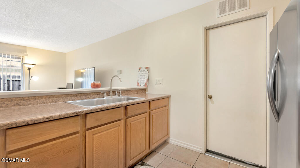 152 Ripley Street Camarillo, CA 93010 - Photo 17 of 36 a bathroom with a granite countertop sink and a mirror
