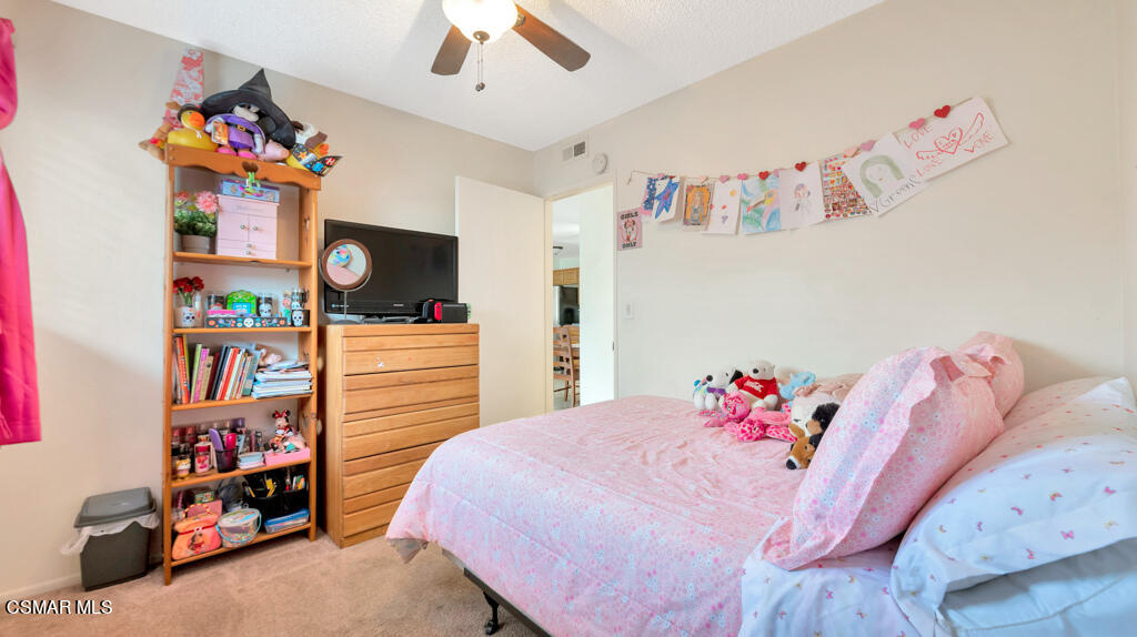 152 Ripley Street Camarillo, CA 93010 - Photo 19 of 36 a bedroom with furniture and a book shelf