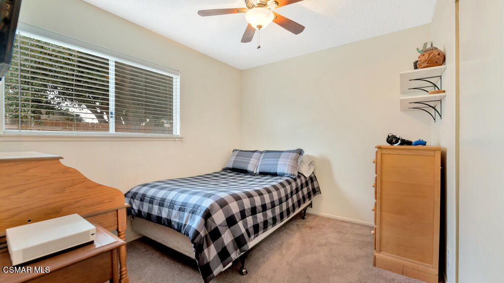 152 Ripley Street Camarillo, CA 93010 - Photo 21 of 36 a bedroom with a bed and a window