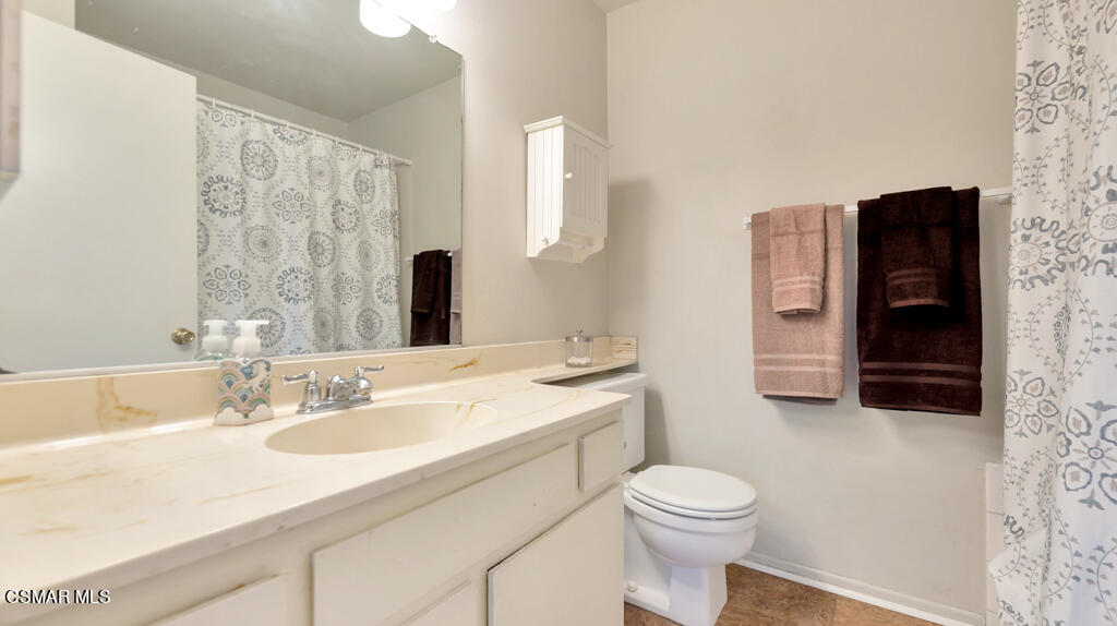 152 Ripley Street Camarillo, CA 93010 - Photo 22 of 36 a bathroom with a sink a toilet and shower curtain
