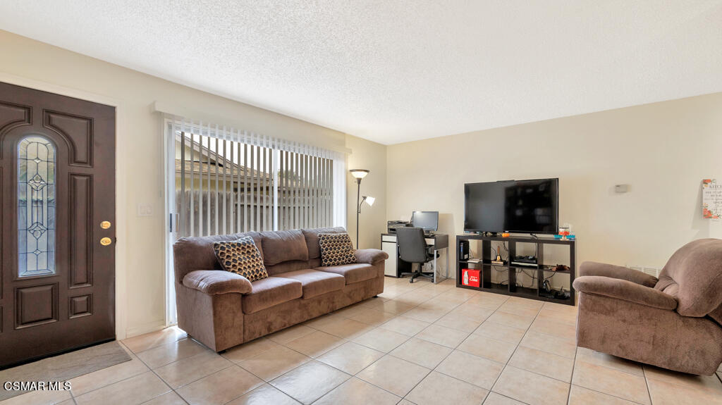 152 Ripley Street Camarillo, CA 93010 - Photo 4 of 36 a living room with furniture and a flat screen tv