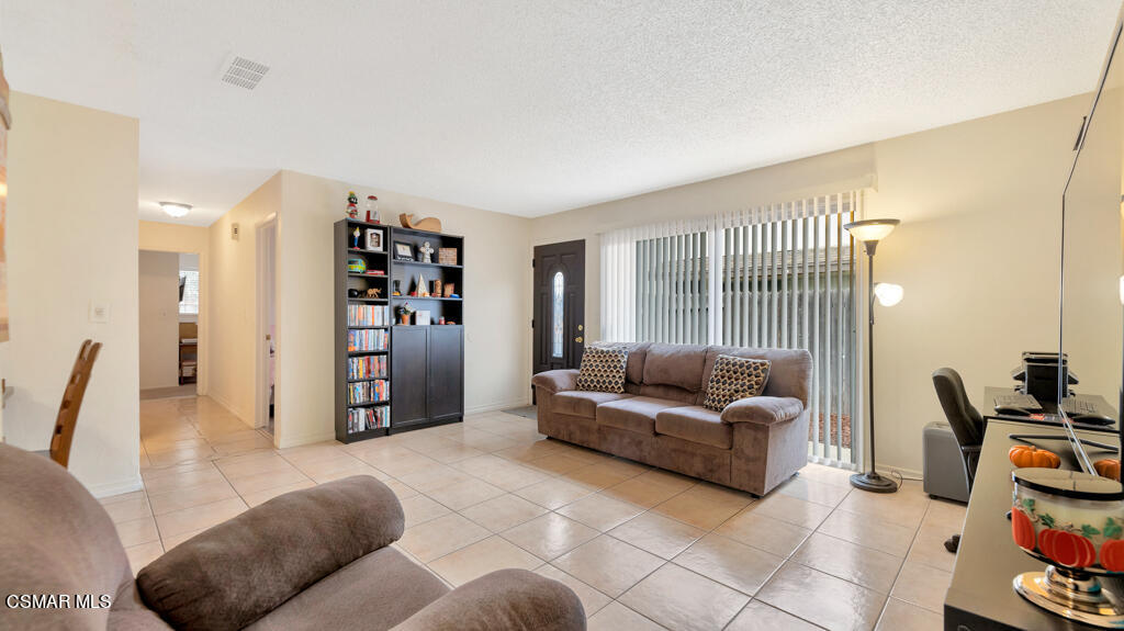 152 Ripley Street Camarillo, CA 93010 - Photo 6 of 36 a living room with furniture and a flat screen tv