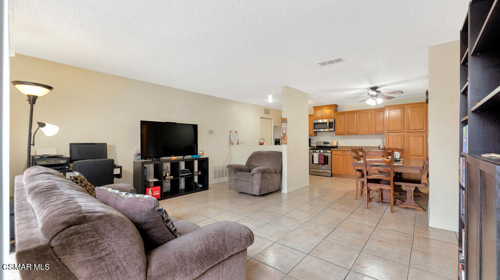 152 Ripley Street Camarillo, CA 93010 - Photo 7 of 36 a living room with furniture and a flat screen tv