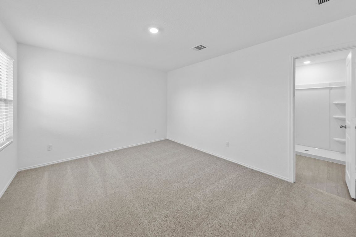 245 Ammolite Lane Maxwell, TX 78656 - Photo 12 of 17 an empty room with a bathroom