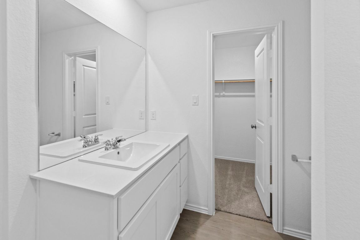 245 Ammolite Lane Maxwell, TX 78656 - Photo 15 of 17 a bathroom with a sink and a mirror