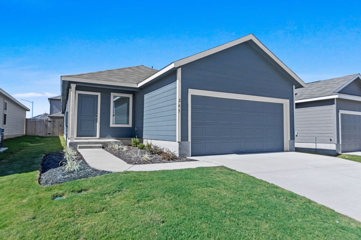 245 Ammolite Lane Maxwell, TX 78656 - Photo 2 of 17 a front view of a house with garden