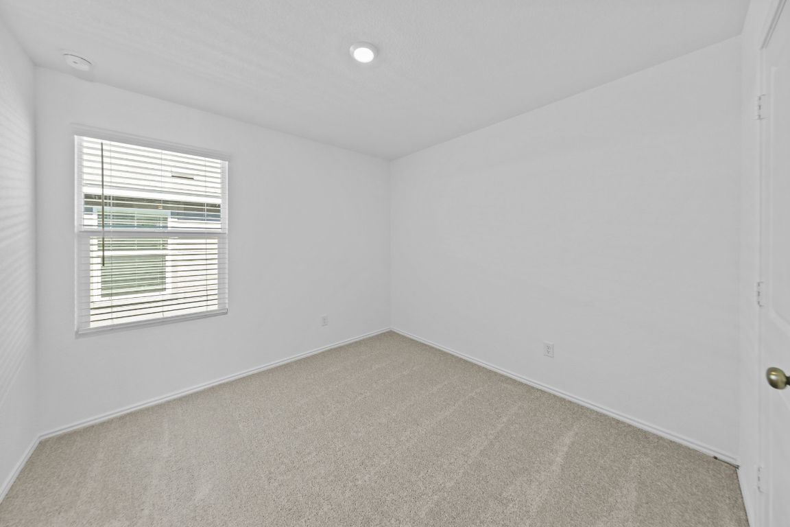 245 Ammolite Lane Maxwell, TX 78656 - Photo 5 of 17 an empty room with a window