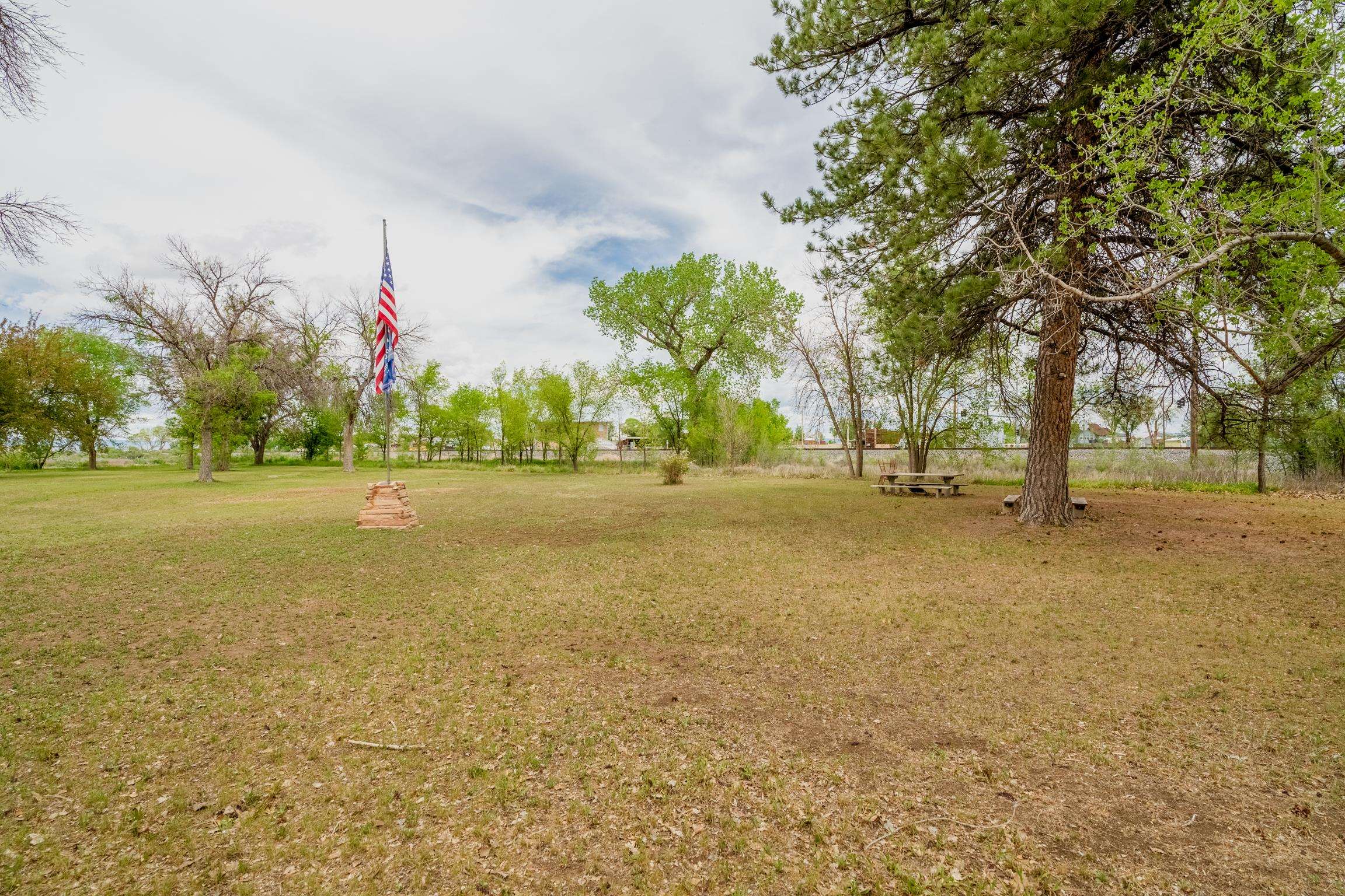 1296 M 1/4 Road Loma, CO 81524 - Photo 13 of 32 a view of dirt field with trees
