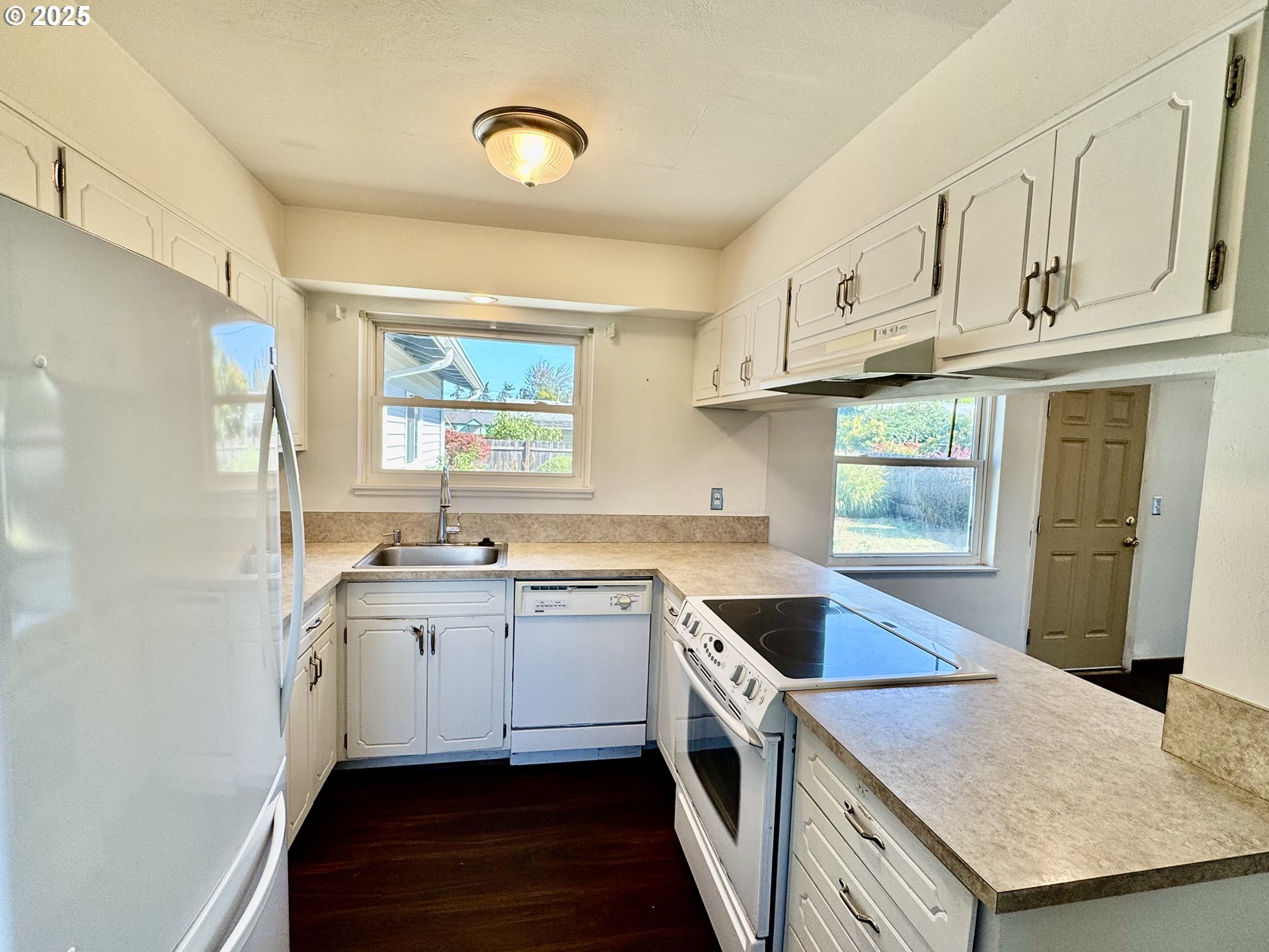 1915 Carter Lane Springfield, OR 97477 - Photo 14 of 30 a kitchen with stainless steel appliances granite countertop a sink stove and refrigerator