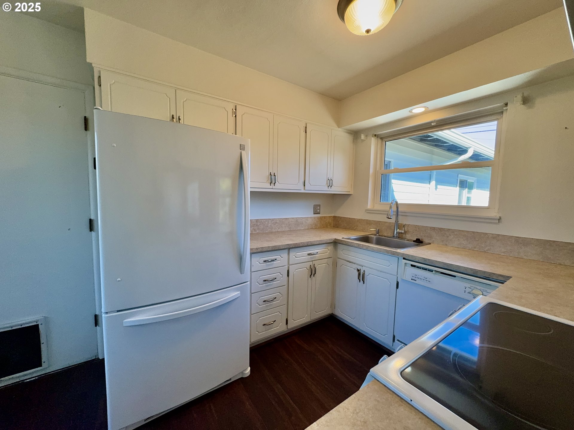 1915 Carter Lane Springfield, OR 97477 - Photo 16 of 30 a white refrigerator freezer sitting inside of a kitchen