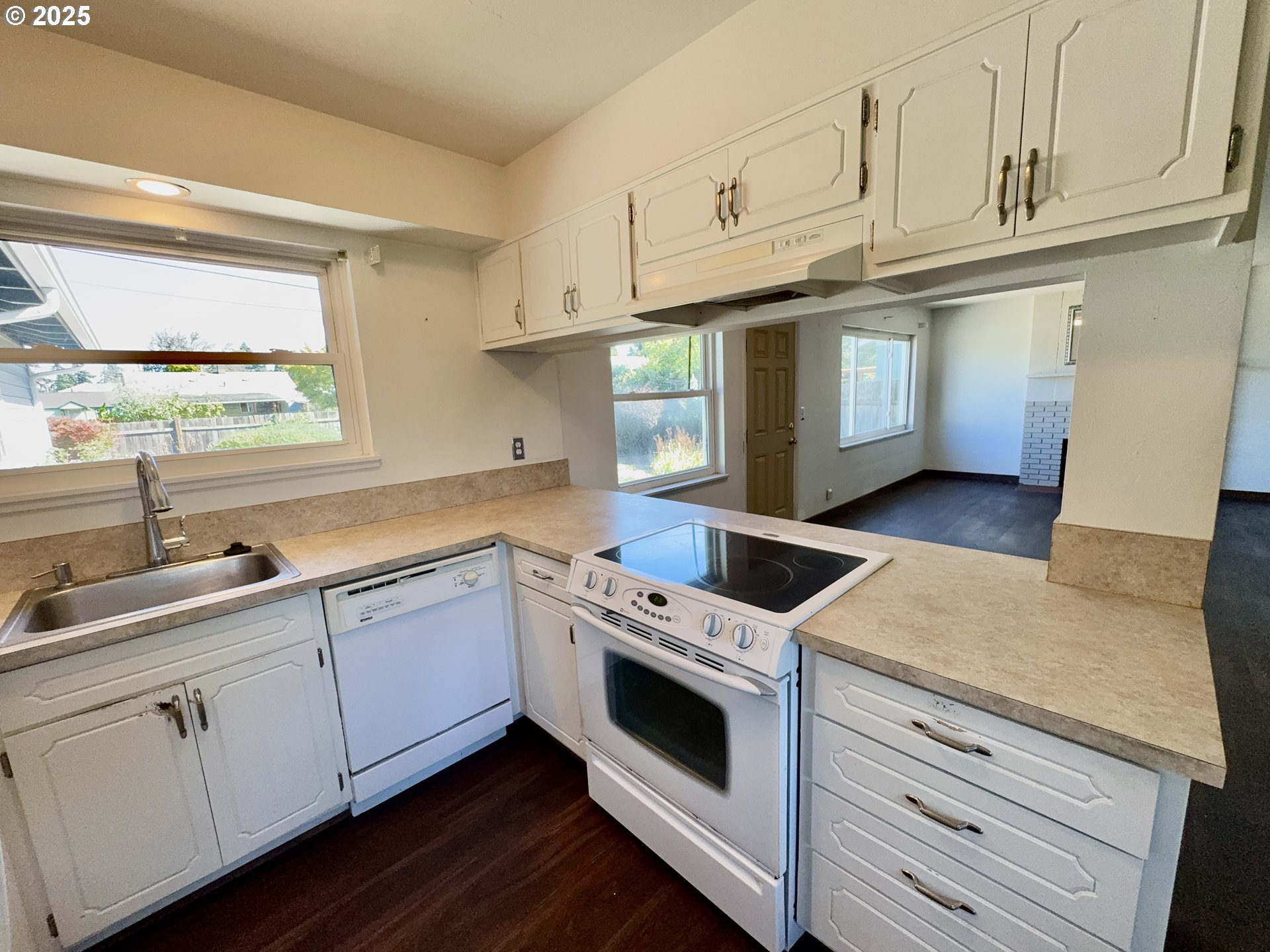 1915 Carter Lane Springfield, OR 97477 - Photo 17 of 30 a kitchen with granite countertop white cabinets and white appliances