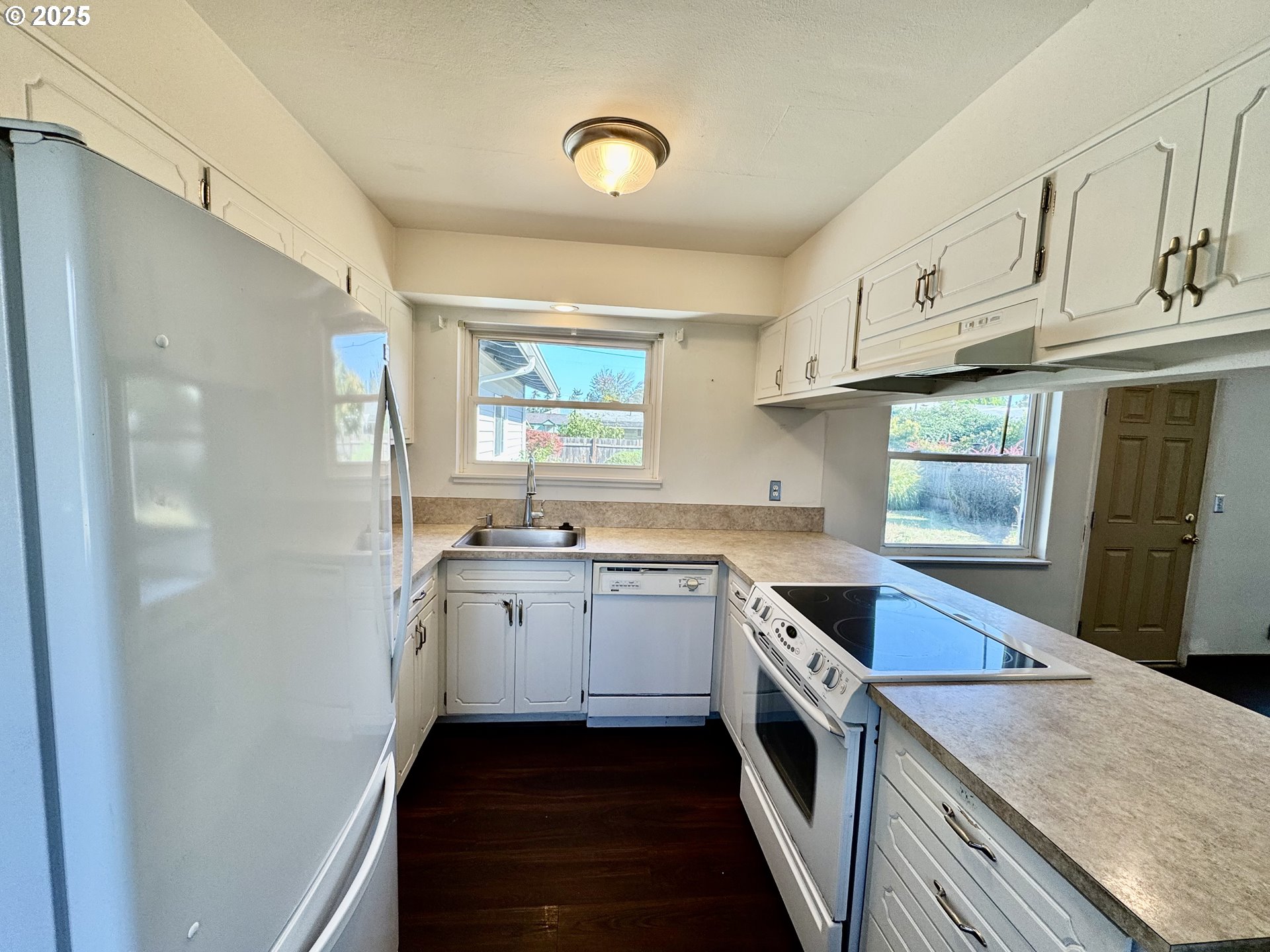 1915 Carter Lane Springfield, OR 97477 - Photo 18 of 30 a kitchen with a sink stove and cabinets