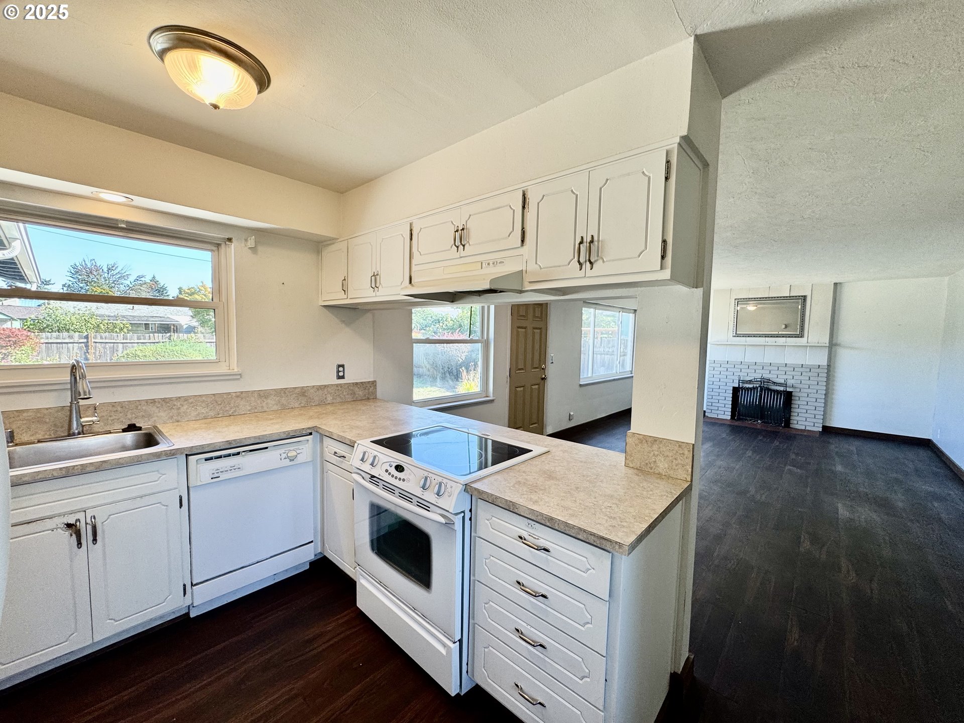 1915 Carter Lane Springfield, OR 97477 - Photo 20 of 30 a kitchen that has a lot of cabinets in it and wooden floors