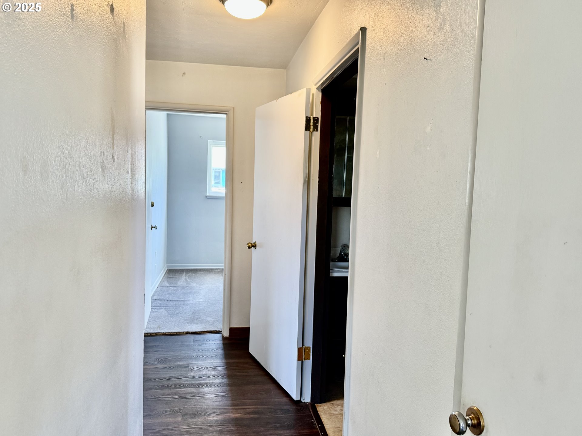 1915 Carter Lane Springfield, OR 97477 - Photo 7 of 30 a view of a hallway with wooden floor