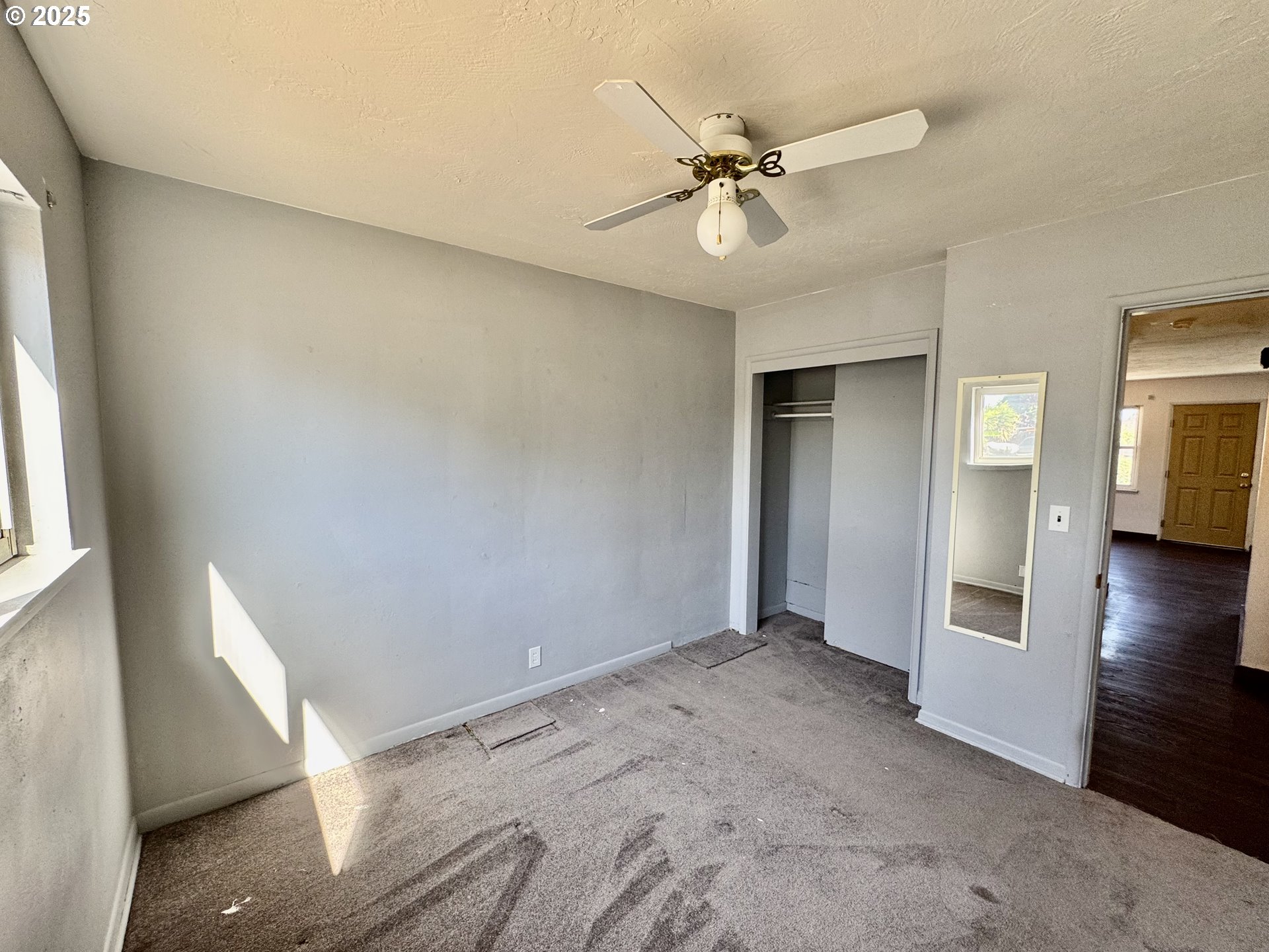 1915 Carter Lane Springfield, OR 97477 - Photo 10 of 30 a view of an empty room with wooden floor and a window
