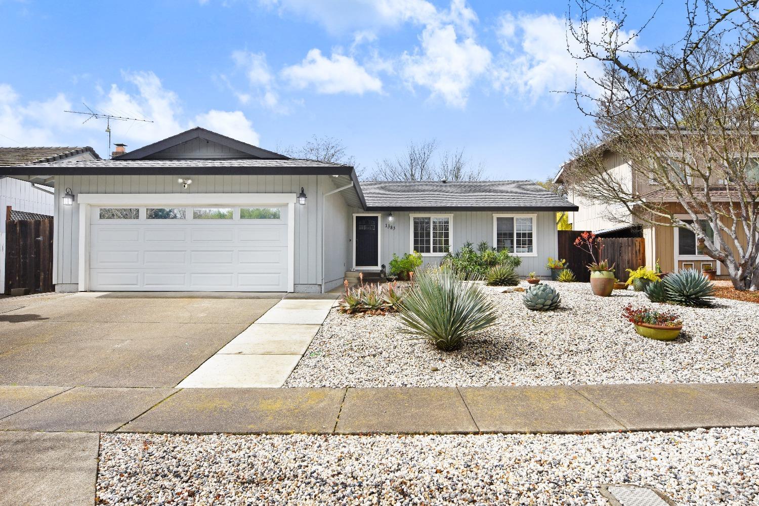 a front view of a house with yard