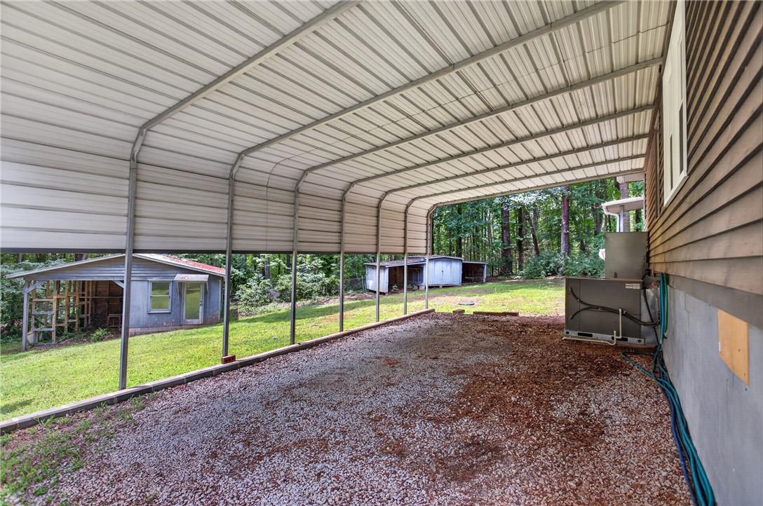 230 Dickard Road Seneca, SC 29672 - Photo 21 of 25 A spacious covered carport provides shelter with convenient access to the house.