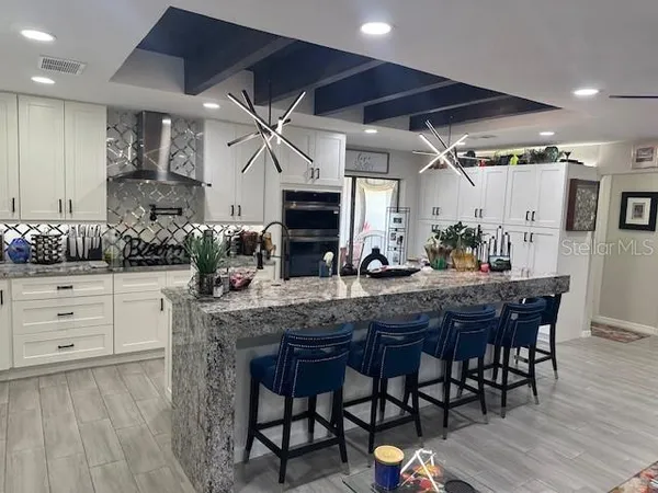 a kitchen with a table and chairs in it