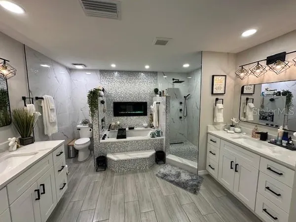 a large bathroom with a double vanity sink double vanity and a mirror