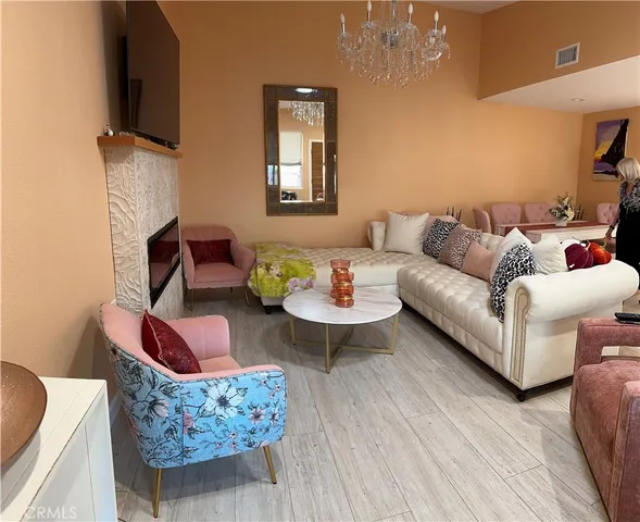 a living room with furniture fireplace and a flat screen tv