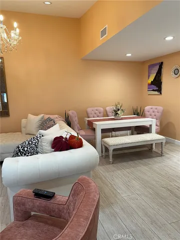 a bedroom with a bed and a night stand