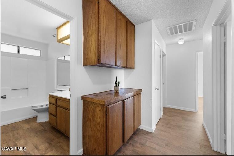 2852 San Ramon Drive Lancaster, CA 93535 - Photo 14 of 32 a bathroom with a sink a toilet and bathtub