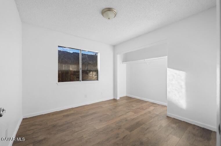 2852 San Ramon Drive Lancaster, CA 93535 - Photo 22 of 32 a view of an empty room with window and wooden floor