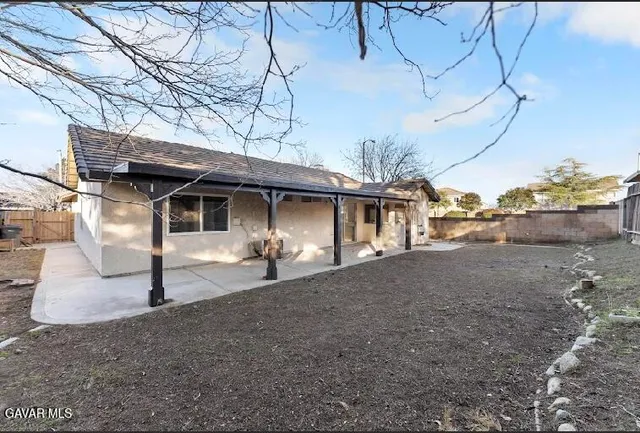 a view of a house with a tree