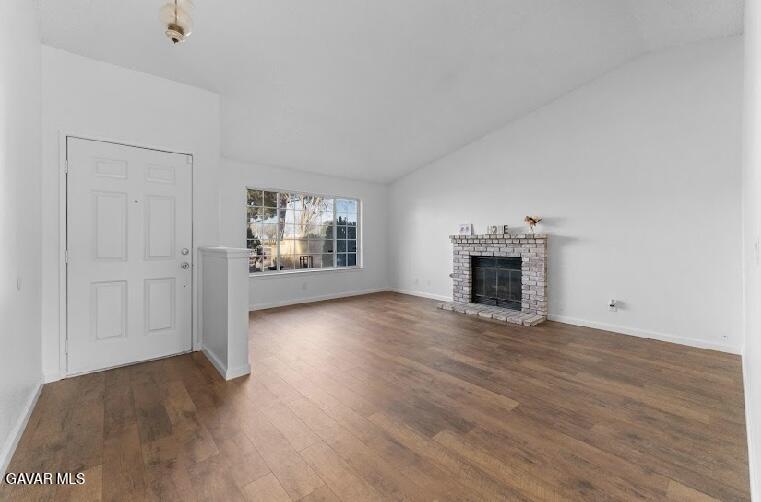 2852 San Ramon Drive Lancaster, CA 93535 - Photo 6 of 32 a view of empty room with wooden floor and fireplace
