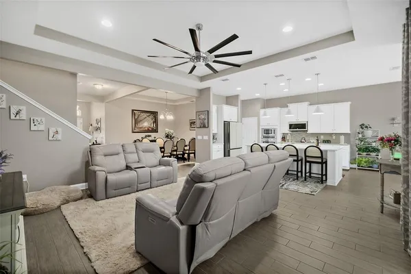 a kitchen with stainless steel appliances a stove sink microwave and cabinets